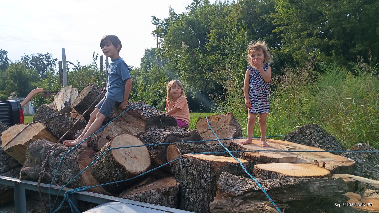 All three kids on top of the cherry haul