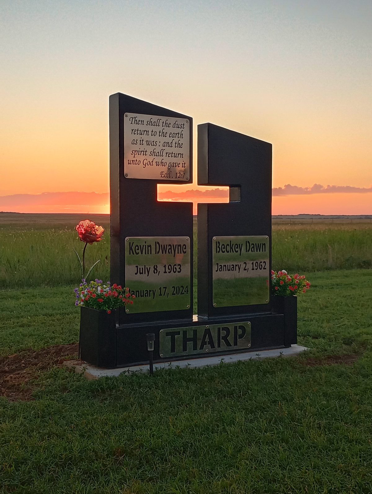 Memorial at sunset with light through cross