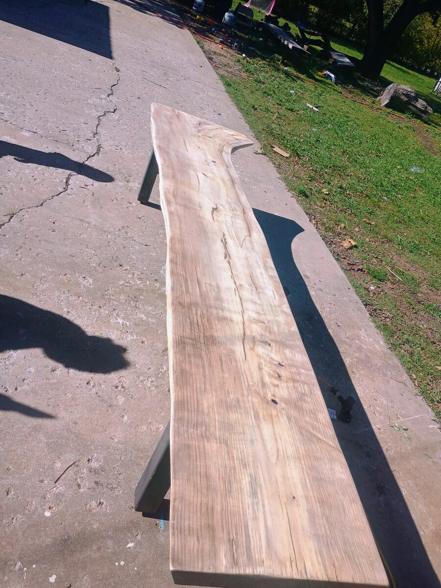 Full length after refinishing — the grain swirl stands out
