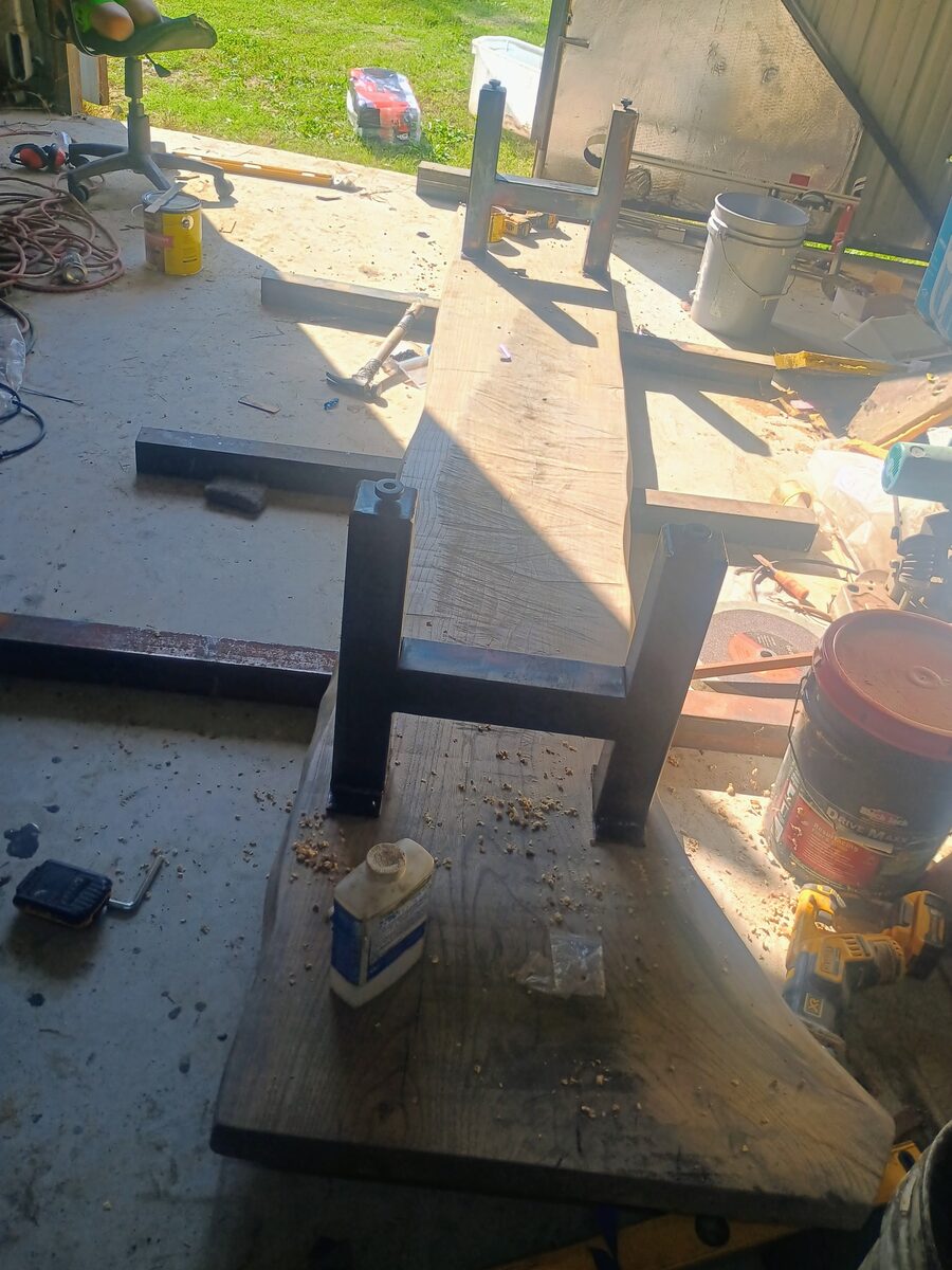 Final assembly — legs painted black, slab finished