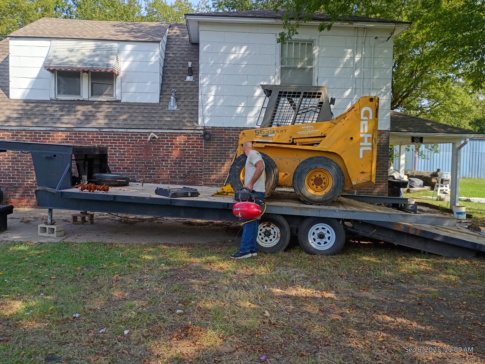 Working on the tires while it was still on the trailer
