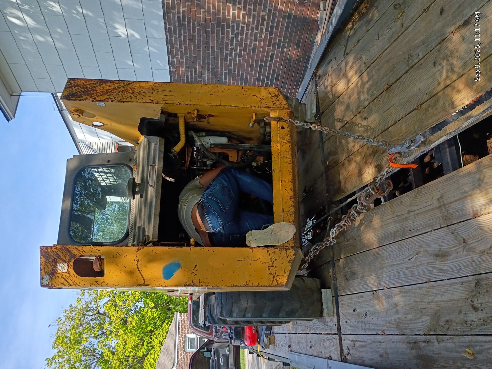 Climbing into the engine bay on the trailer