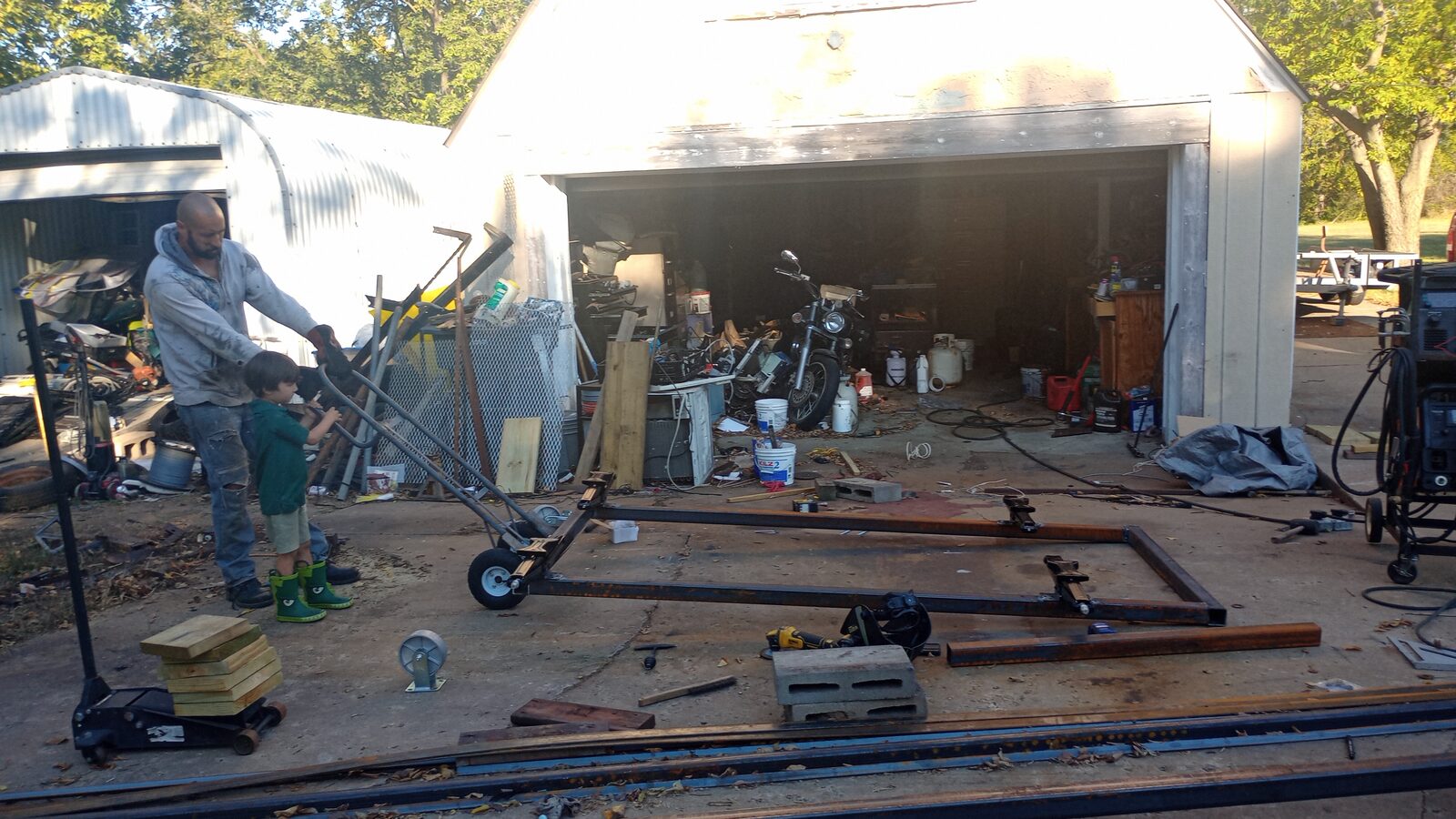 Roller parts laid out — caster wheels and steel frame members