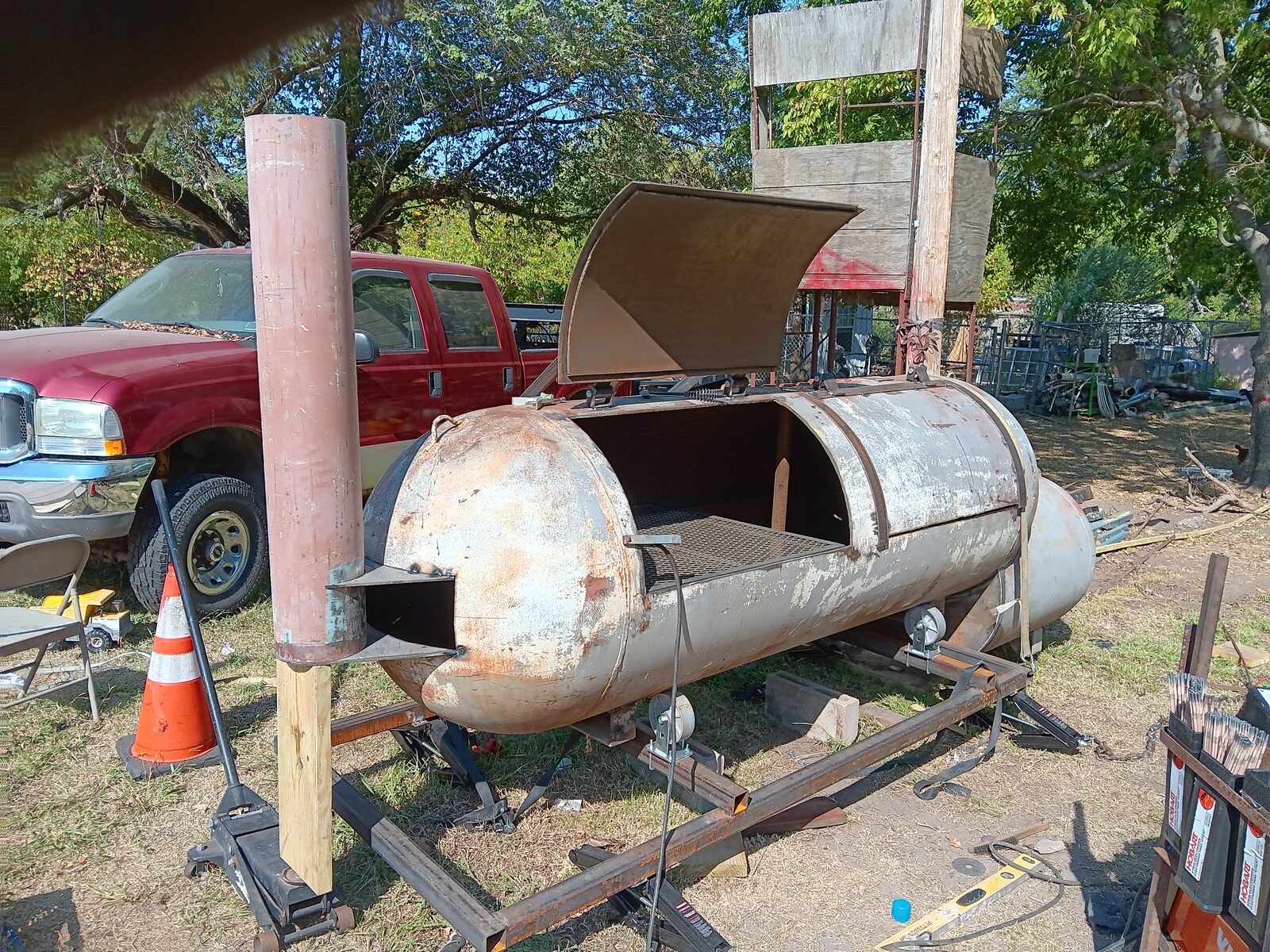 Chimney stack installed on the smoker — firebox attached, taking shape