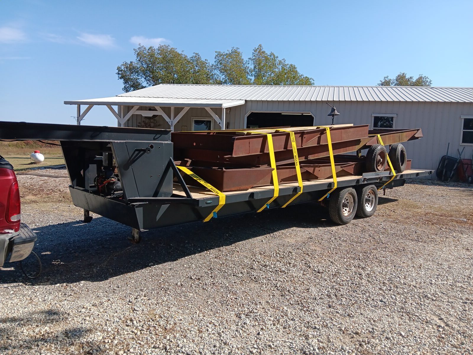 Mobile home frames on a trailer — raw material for the kiln frame